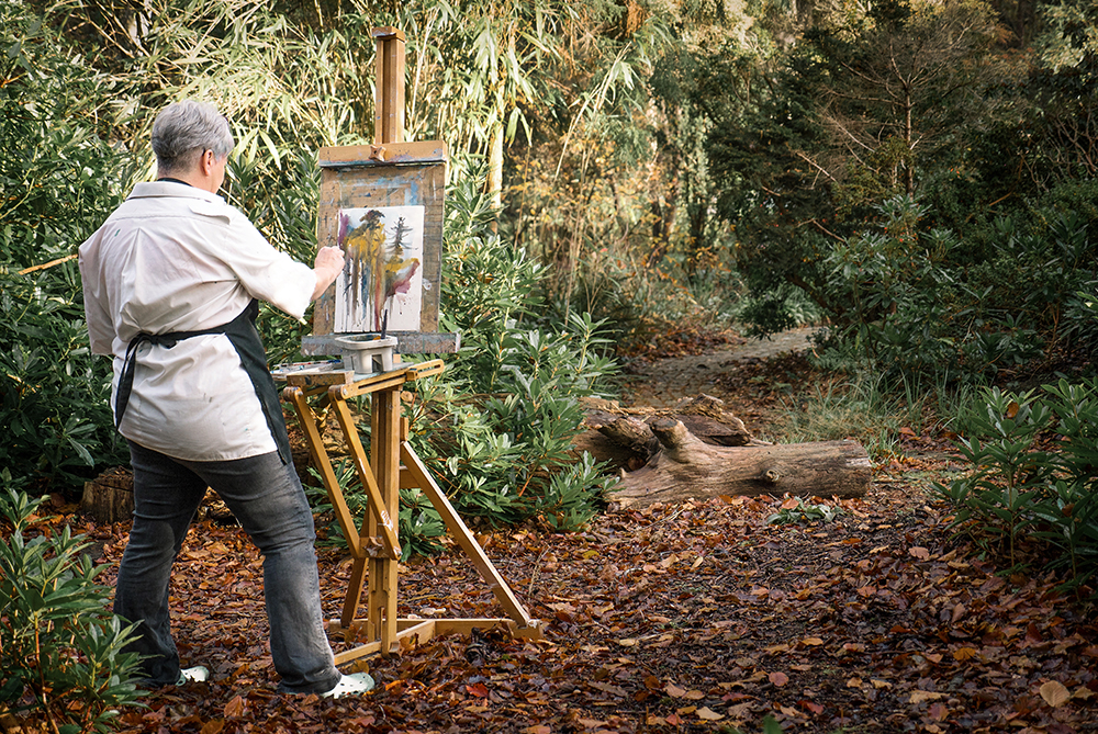 Artist being photographed painting